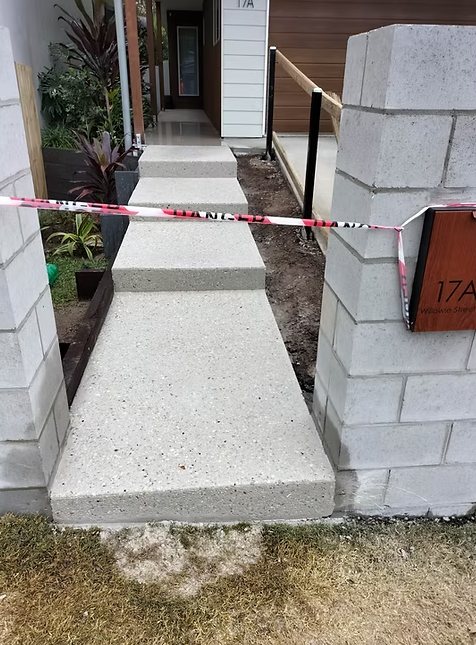 Honed concrete entry steps to a Brisbane home